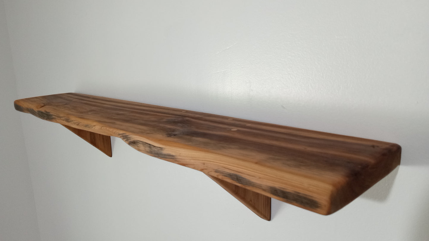 A profile picture of the rustic wall shelf laying bare to showcase the beautiful cypress wood.