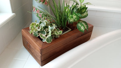 Large Cedar Planter Box on bathtub edge with variegated ivy, pothos, and grass-like plant; crafted cedar with mitered corners, showcasing indoor greenery.