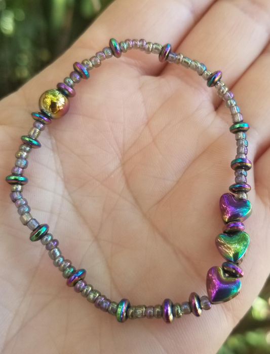 Magnetic rainbow hematite with glass beads