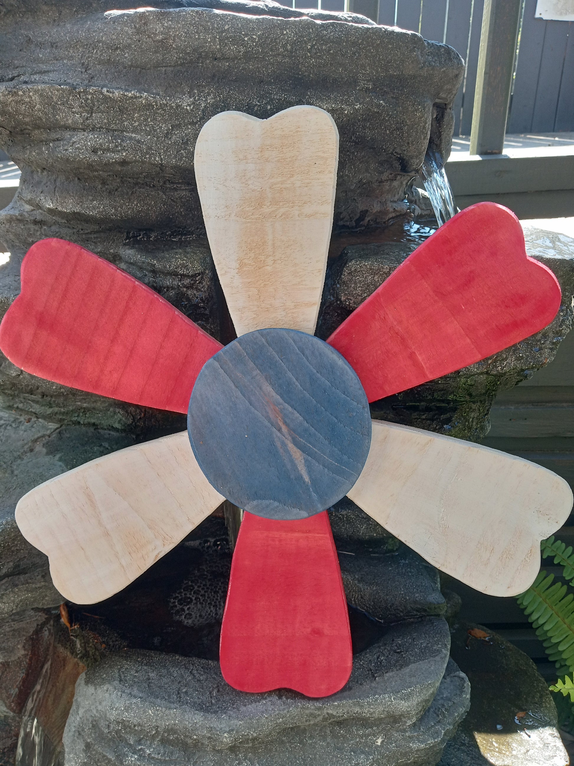 Close-up of wooden sunflower petals showing craftsmanship detail.