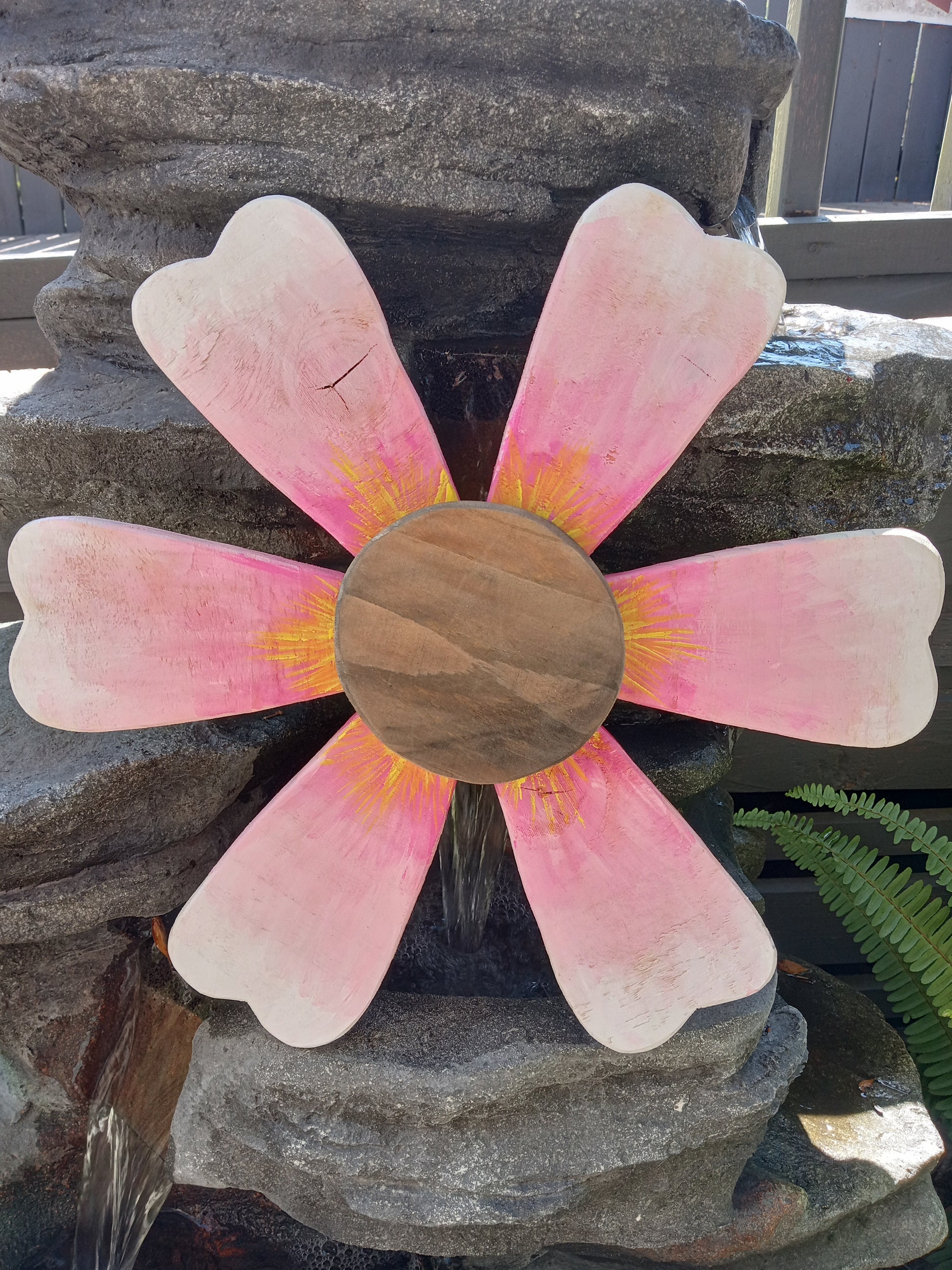 Close-up of wooden sunflower petals showing craftsmanship detail.