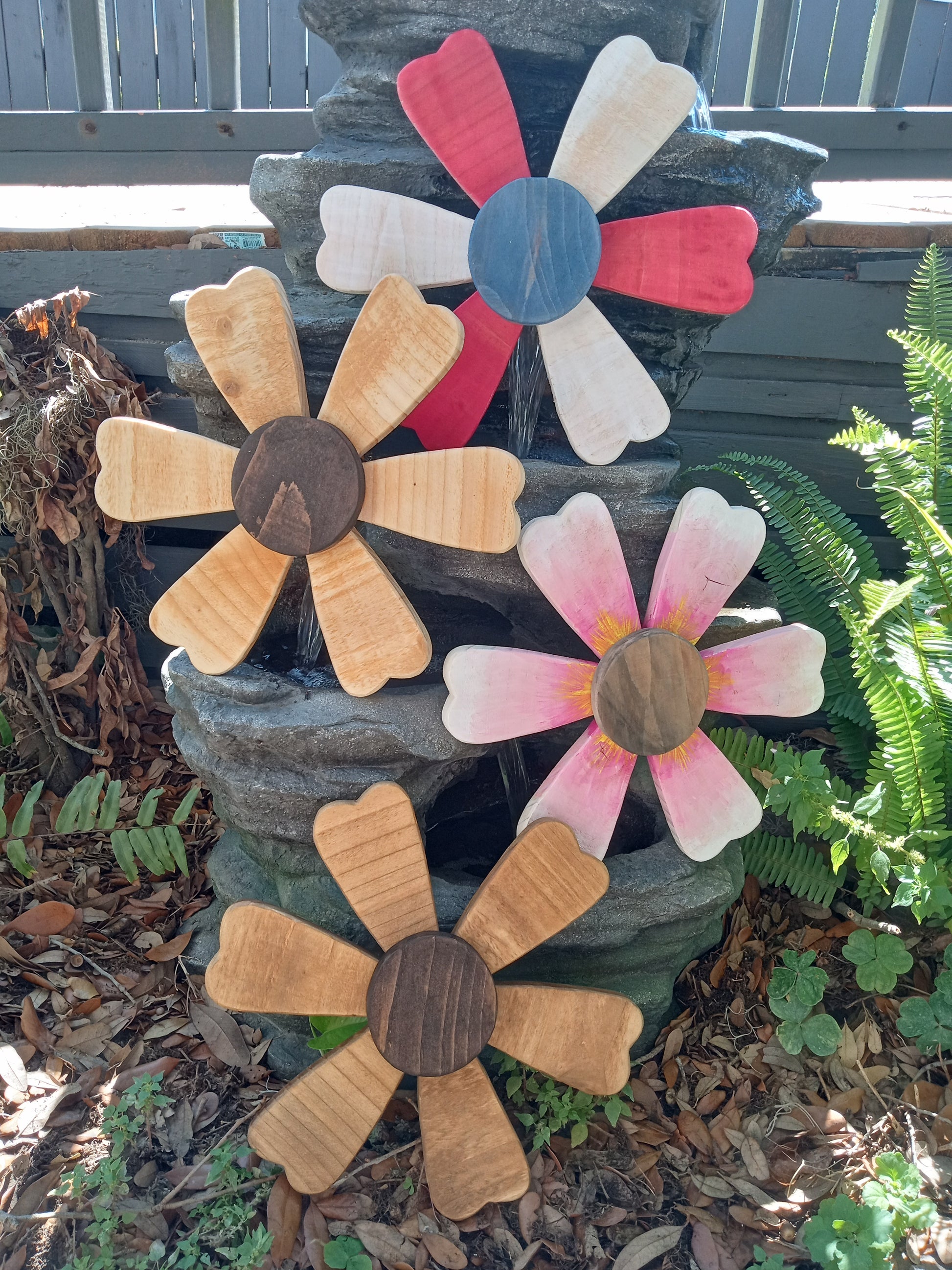 Small wooden sunflower collection showing size options.